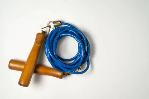 A skipping rope on a white background. Flat lay view concept