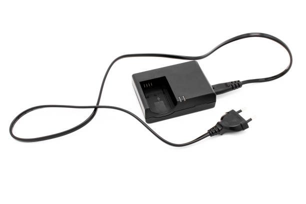 istock Camera charger for rechargeable batteries isolated on white 1290261451