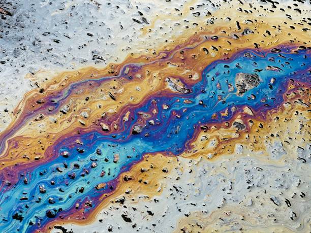 istock Eco concept , oil spill on asphalt road 1290263216