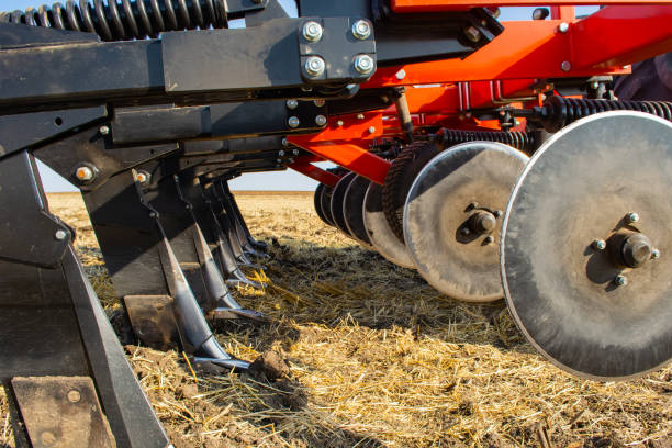 istock work of the trailed unit for tillage in the field 1290263620