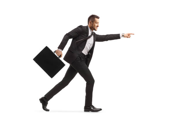 istock Businessman with a briefcase running and pointing forward 1290265480