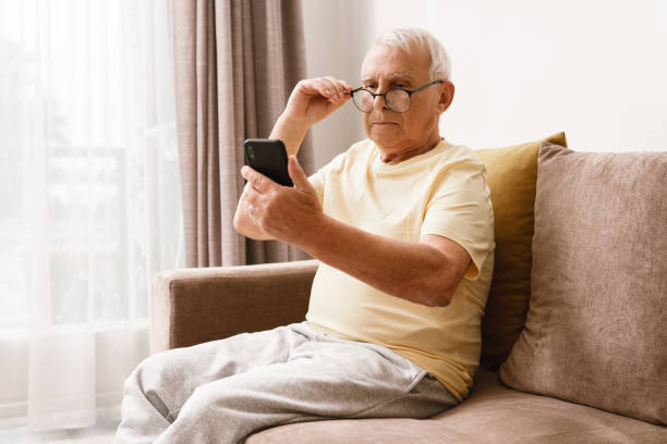istock Senior man wearing eyeglasses is using smartphone 1290266312