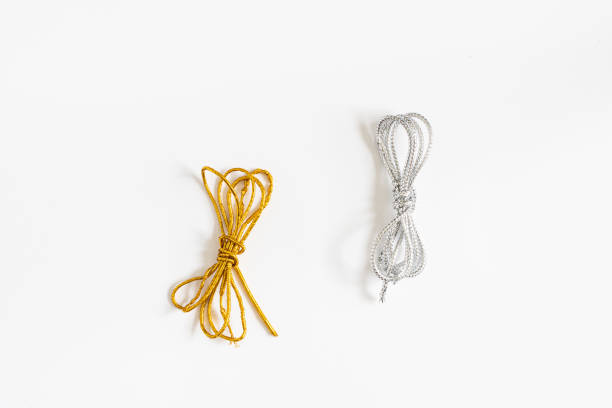 silver and gold twine on silverbackground macro