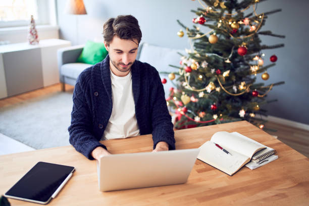 istock Young man working from home during christmas 1290266430