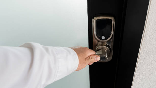 istock The hand that is opening the door with a handle knob 1290266493