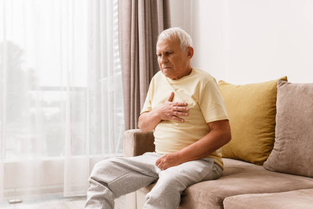 Senior man have pain in chest. Acid reflux or heart attack. Senior man have pain in chest. Concepts of different problems like acid reflux or heart attack. gastroesophageal reflux disease photos stock pictures, royalty-free photos & images
