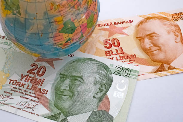 istock Close up Turkish lira banknotes with mini earth globe 1290267865