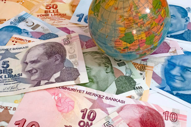 istock Close up Turkish lira banknotes with mini earth globe 1290268179