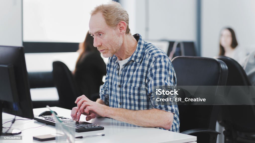 Man Using Computer Office Man Using Computer In Office Stock Photo - Download Image Now - 55-59 ...