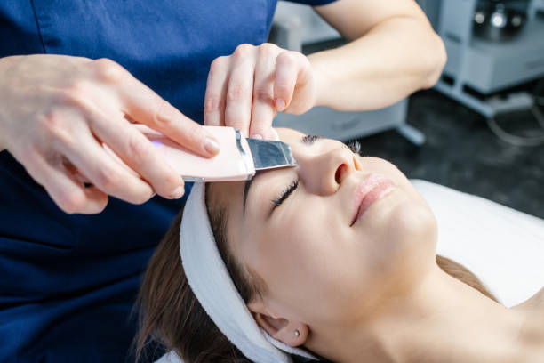 istock Ultrasound cleaning procedure face skin therapy 1290270368