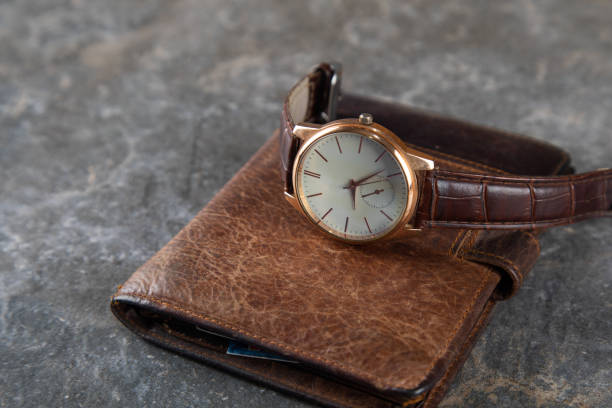 istock watch on the wallet on the table 1290271067