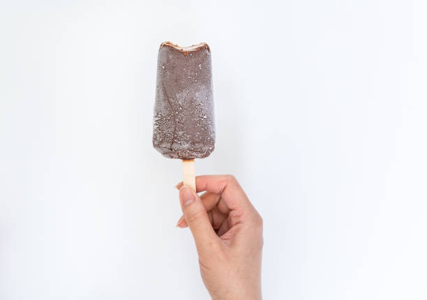 istock Chocolate popsicle isolated，Bitten ice cream 1290272227
