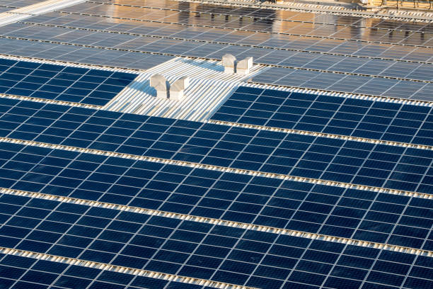 istock Solar panels on an industrial roof 1290272652