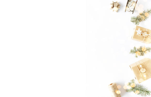 istock Christmas background flat lay on white surface. Handmade gift boxes, holiday decorations, fir branches. Christmas present concept. Flat lay, top view, copy space 1290273783