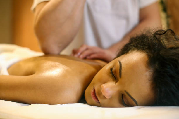 istock Young woman having a back massage 1290274776