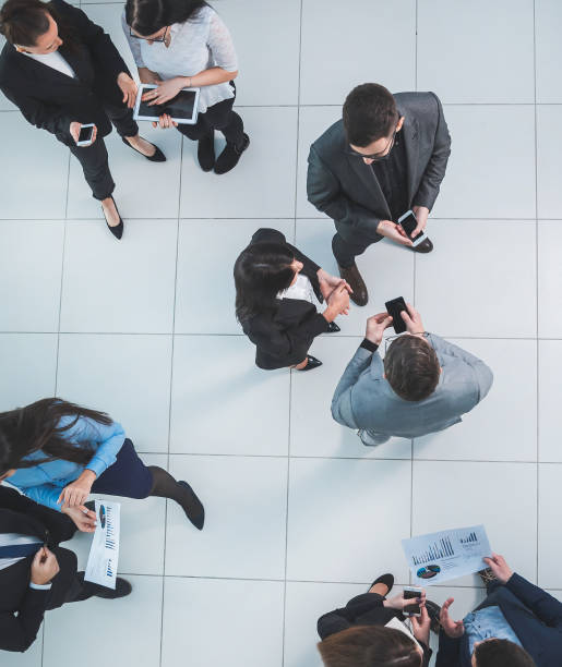 istock top view. employees discussing financial data before the meeting 1290275419