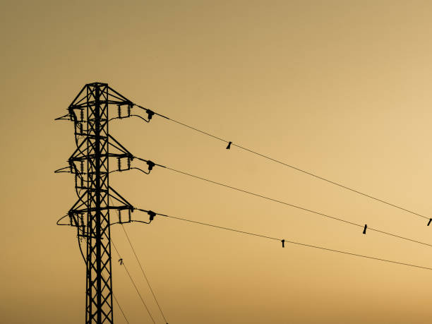 istock High voltage towers against sunset sky 1290277432