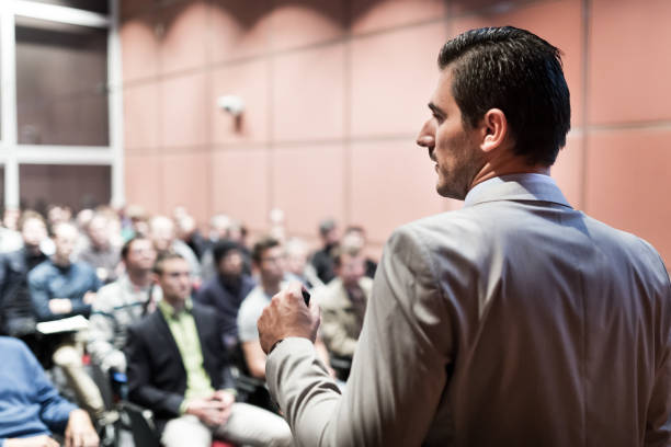 istock Public speaker giving talk at business event. 1290277725