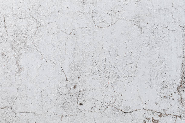 istock Old cracked concrete wall texture. Weathered background. 1290277814