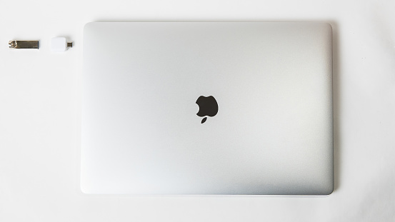 Belarus, Minsk - July 13, 2020: Apple Inc. product design Space gray Macbook Pro. Photo with space for text.