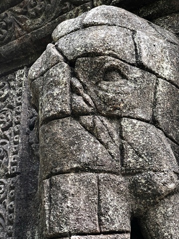 Close up photo of an elephant stone relief (or carving) with scars, taken on 8th December 2020, at Bali Zoo, Bali, Indonesia.