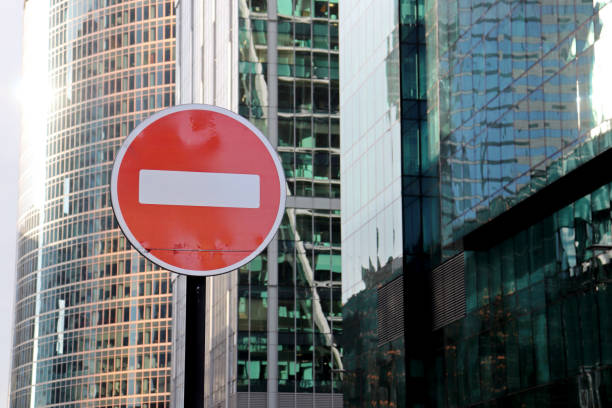 istock No entry sign on the skyscrapers background, entry is prohibited 1290280687