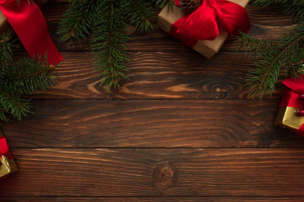 istock Christmas background with decorations and gift boxes on wooden table. Top view. Copy space.  Merry christmas and happy new year 1290284493