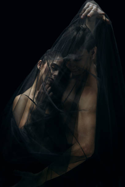 istock Graceful classic ballet dancers isolated on black studio background. The grace, artist, movement, action and motion concept. 1290288070