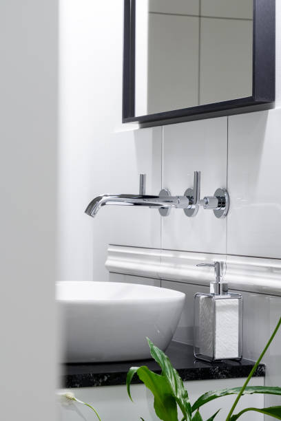 istock Stylish silver faucet in bathroom 1290295672