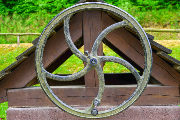 istock Large iron wheel for the well 1290296257