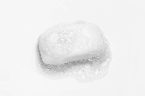 istock Soap bar and foam on white background 1290298269