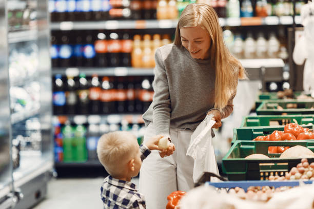 istock Woman at the supermarket with her son 1290299535