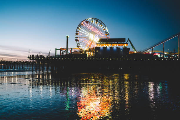 istock Illuminated Ferris wheel with dawn sky on background 1290299602