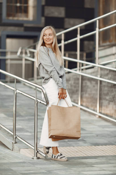 istock Elegant woman with a shopping bag 1290300663