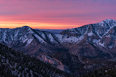 Colorful sunrise over snow covered mountain peaks within the Spring Mountains, Nevada