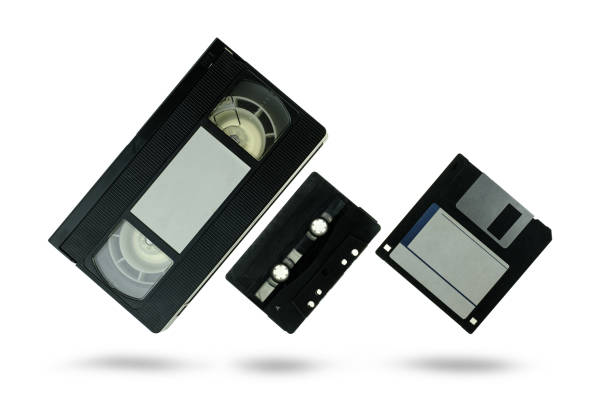 istock Videocassette audio cassette tape and floppy disk on white background 1290302061