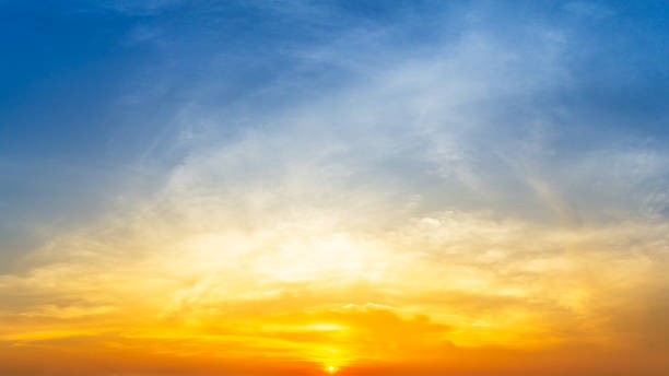 istock Orange sunrise and fluffy cloud sky nature background 1290304574
