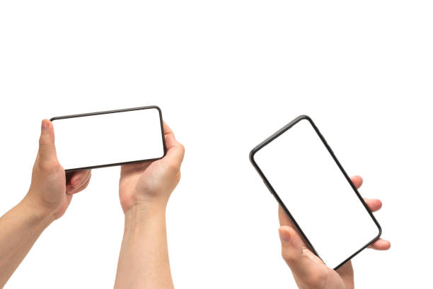 istock Smart phone in man hand isolated on white background.  White screen. 1290304769