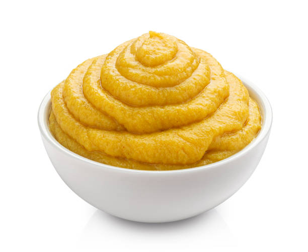 istock Mustard in bowl isolated on white background 1290306512
