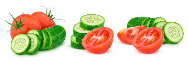 istock Fresh tomato and sliced cucumber isolated on white background 1290306545