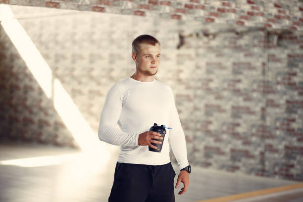 istock A handsome man is engaged in a gym 1290309374
