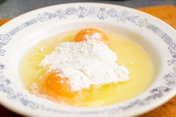 istock Flour with raw chicken eggs in a plate. Chop batter, frying. 1290312224
