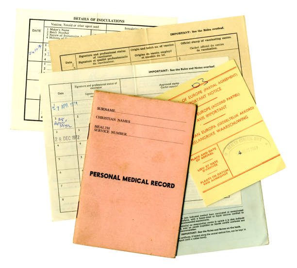 Group of old medical and inoculation documents, 1970s A group of old medical, inoculation and vaccination certificates and documents from the 1970s. Identifying details have been removed. polio virus photos stock pictures, royalty-free photos & images