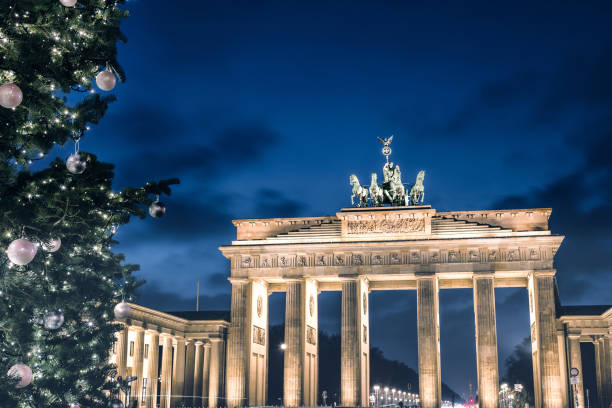 istock Brandenburger Tor behind festive iluminated christmas tree at blue hour 1290314913