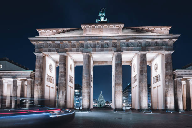 istock Brandenburger Tor in front of festive iluminated christmas tree at night 1290314982