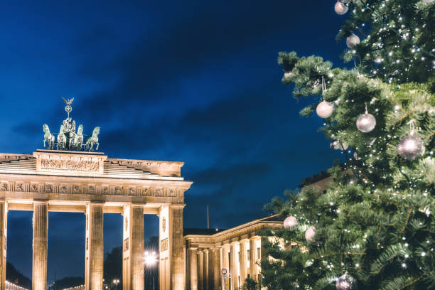 istock Brandenburger Tor behind festive iluminated christmas tree at blue hour 1290315809