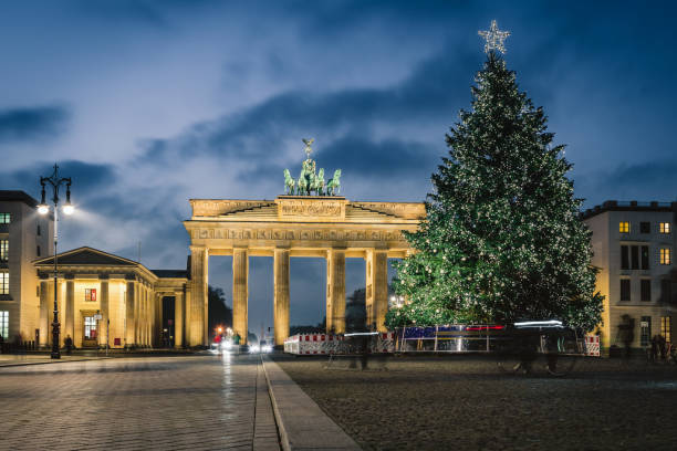 istock Brandenburger Tor behind festive iluminated christmas tree at blue hour 1290316025