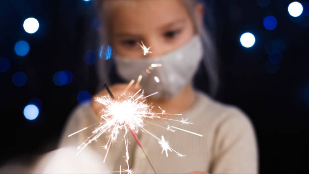 istock Cheerful child girl with Sparkler 1290317499