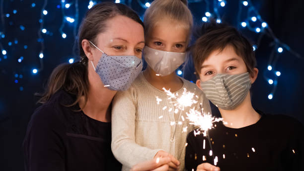 istock Family with sparklers for christmas 1290317507