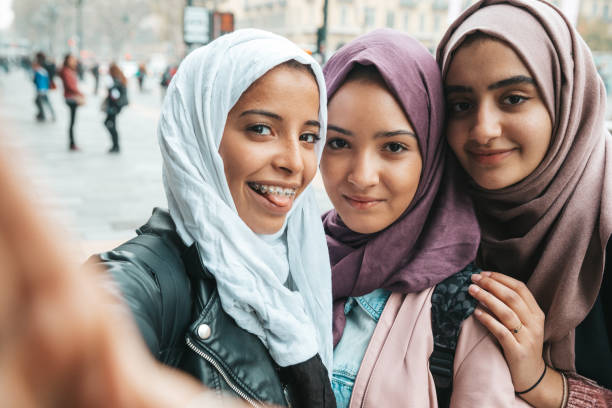 istock Three happy friends smiling to camera 1290318212